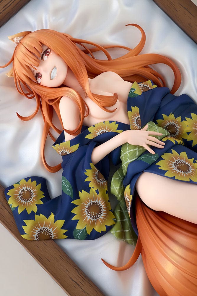 Spice and Wolf KD Colle Holo (Yukata Beauty Ver.) 1/7 Scale Figure reclining in a sunflower-patterned yukata with flowing orange hair.