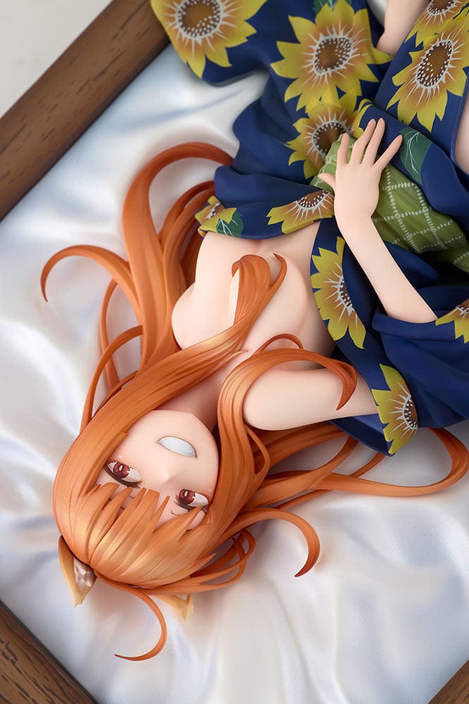 Spice and Wolf KD Colle Holo (Yukata Beauty Ver.) 1/7 Scale Figure reclining in a sunflower-patterned yukata with flowing orange hair.