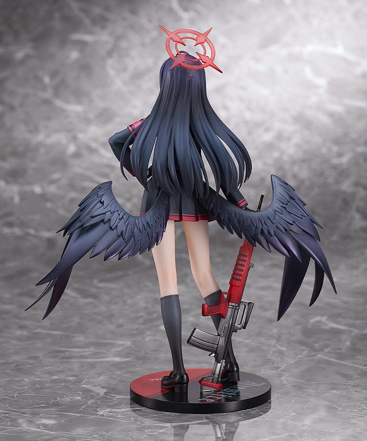 Blue Archive Ichika 1/7 scale figure in a dark school uniform with black wings, holding a red weapon and wearing a symbolic red halo-like accessory, with a calm, closed-eyed expression.