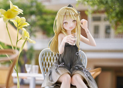 Nabi Illustration Toshishita Kanojo 1/6 Scale Figure featuring a blonde girl seated on a chair with a black dress, holding a drink, and accompanied by a vase of yellow flowers.