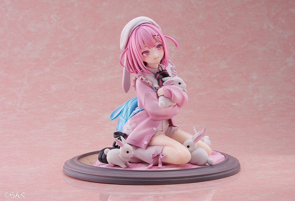 Illustrator Collection Figure Toshishita Kanojo 1/6 Scale Figure, featuring a pink-haired girl in pastel clothing surrounded by small rabbits on a circular base.