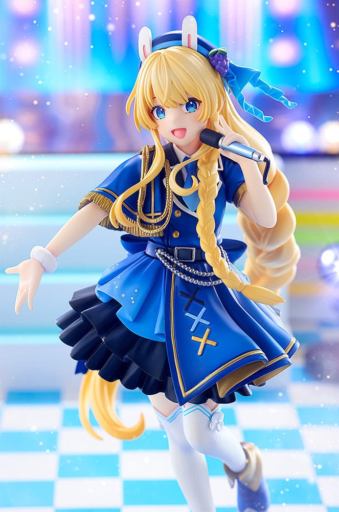 KonoSuba KD Colle Iris (Light Novel Idol Ver.) figure in blue idol outfit with braided blonde hair, bunny ears, and holding a microphone.