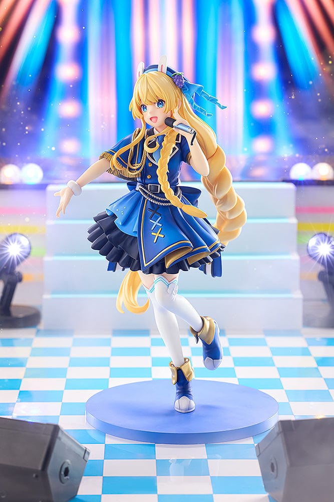 KonoSuba KD Colle Iris (Light Novel Idol Ver.) figure in blue idol outfit with braided blonde hair, bunny ears, and holding a microphone.