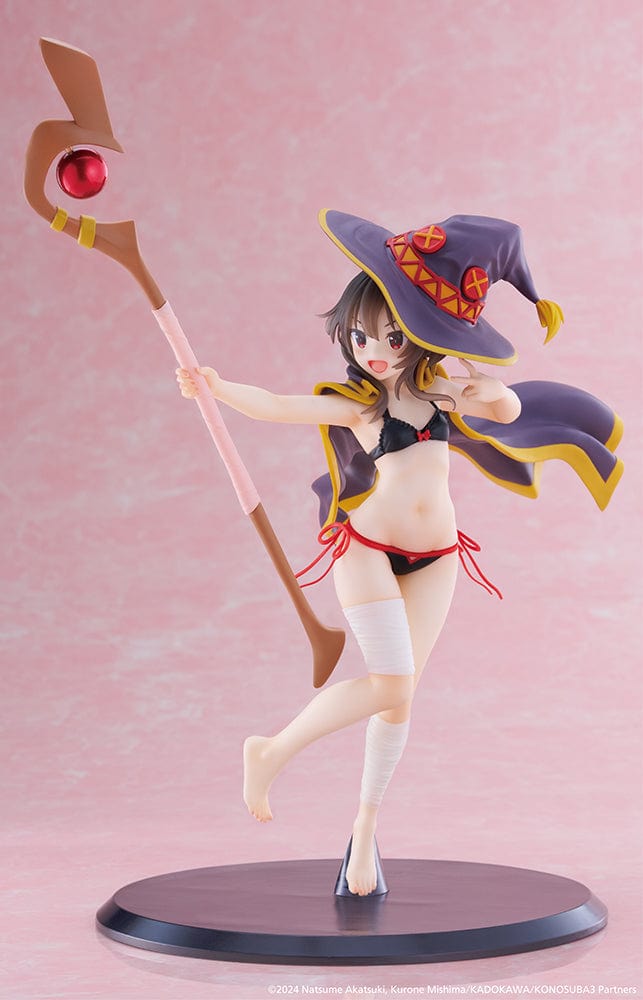 KonoSuba's Megumin Coreful Figure presented in a Swimwear Version, energetically wielding her staff, adorned with her signature hat and a playful swimsuit. The figure captures her mischievous smile and readiness for summer fun, reflecting her explosive character from the beloved anime series.