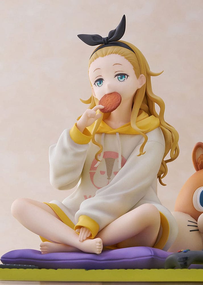 A 1/7 scale figure of Kurumi from the hit anime Lycoris Recoil, dressed in a yellow hoodie, enjoying a snack while sitting cross-legged on a green mat next to a large plush squirrel and a small gaming console.