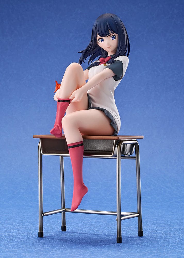 Gridman Universe Rikka Takarada (Daily School Life Ver.) 1/7 Scale Figure seated on school desk in relaxed pose with school uniform and pink socks