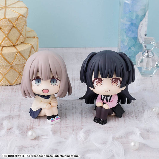 Set of The Idolmaster: Shiny Colors Look Up series figures, featuring Asahi Serizawa with light brown hair and Fuyuko Mayuzumi with black hair, both depicted in a seated, looking-up position and complete with a special gift.