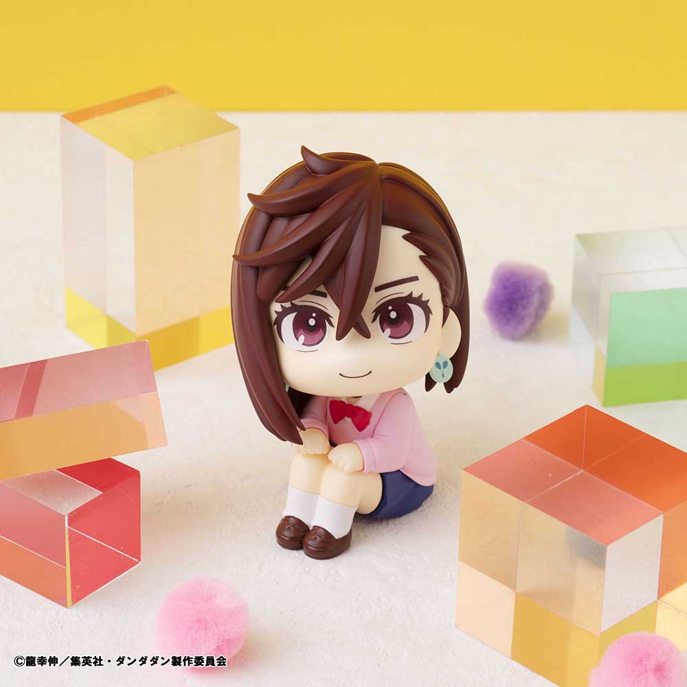 Dandadan Look Up Series Momo Figure, featuring chibi-style design with side-swept hair, pink sweater, schoolgirl outfit, and upward gaze.