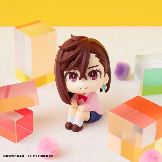 Dandadan Look Up Series Momo Figure, featuring chibi-style design with side-swept hair, pink sweater, schoolgirl outfit, and upward gaze.