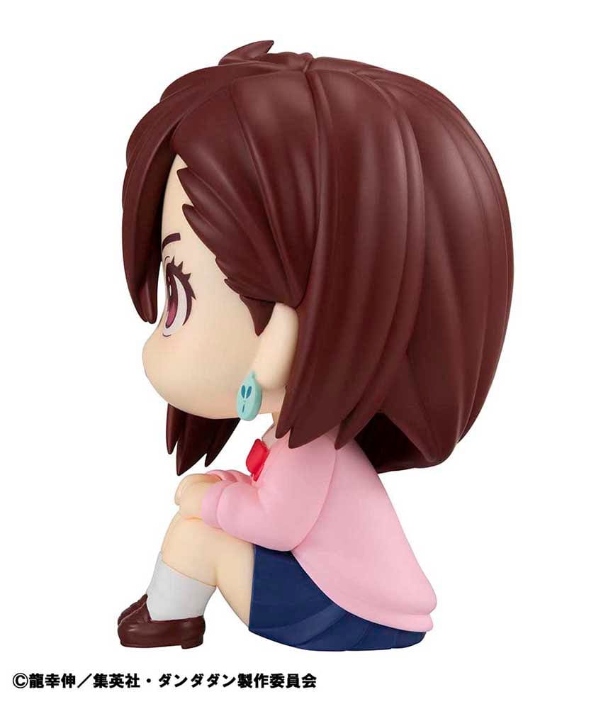 Dandadan Look Up Series Momo Figure, featuring chibi-style design with side-swept hair, pink sweater, schoolgirl outfit, and upward gaze.