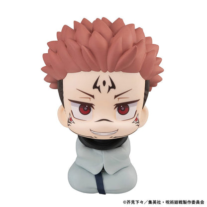 Lookup Figure Jujutsu Kaisen Sukuna in seated chibi form with signature face markings and red eyes, smiling mischievously.