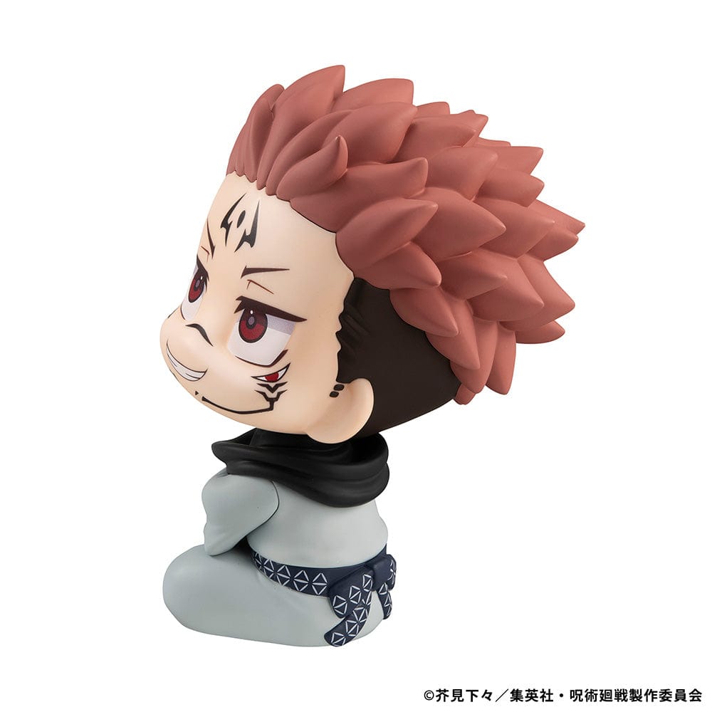 Lookup Figure Jujutsu Kaisen Sukuna in seated chibi form with signature face markings and red eyes, smiling mischievously.