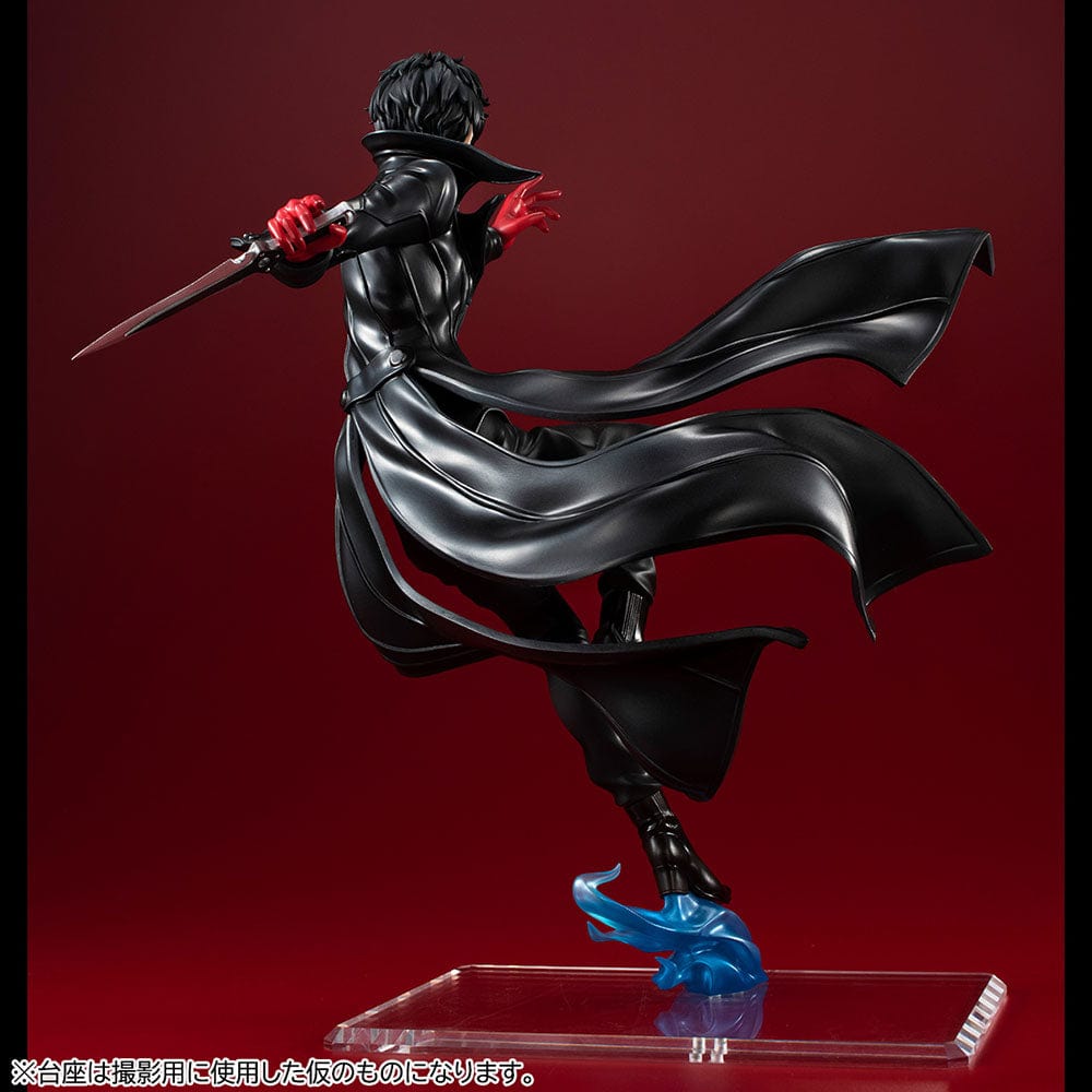 Persona 5 Royal Lucrea Joker (Showtime Edition) figure, featuring Joker in a dynamic pose with a dagger, wearing a black trench coat and mask, on a unique translucent blue base.