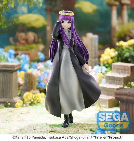 Frieren: Beyond Journey's End Luminasta Fern (Flower Garden) Figure featuring Fern in a long black coat, gray dress, and daisy crown on a grass-textured hexagonal base, set against a white background.