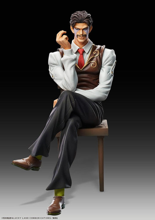 Statue of Daniel J. D'Arby from JoJo's Bizarre Adventure: Stardust Crusaders, depicted seated with a knowing smirk, donning a gray suit with brown vest, red tie, and characteristically styled hair, complete with a chair accessory, against a black backdrop.
