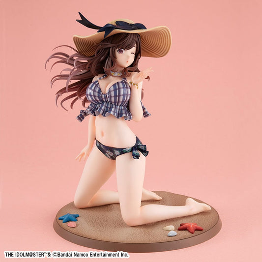 The Idolmaster: Shiny Colors Lucrea figure of Kogane Tsukioka in her Be~Bop Kaigan Version, sporting a playful plaid bikini and sun hat, poised gracefully on a sandy base with starfish and shells, embodying the vibrant spirit of summer and the exuberance of an idol.