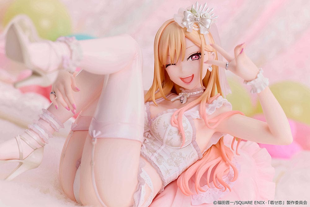 My Dress-Up Darling Marin Kitagawa (Babydoll Ver.) 1/7 scale figure, lounging in white and pink babydoll lingerie, winking playfully while posed on a cushion.