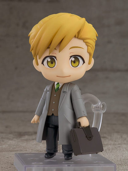 Fullmetal Alchemist: Brotherhood Nendoroid No.2624 Alphonse Elric (Final Episode Ver.) wearing a suit and overcoat, holding a briefcase.