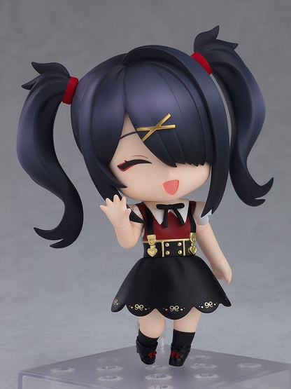 Needy Girl Overdose Nendoroid Ame, featuring her in a black dress with red bow tie and pigtails, standing with a crossed arm pose.