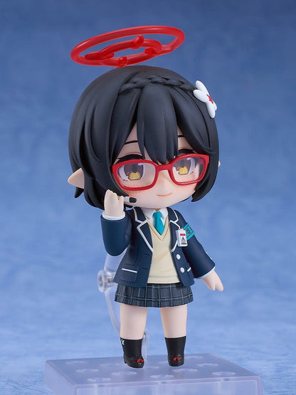 Blue Archive Nendoroid No.2657 Ayane Okusora in a school uniform, with red glasses, dark braided hair with a flower clip, and a red halo accessory, holding a book.