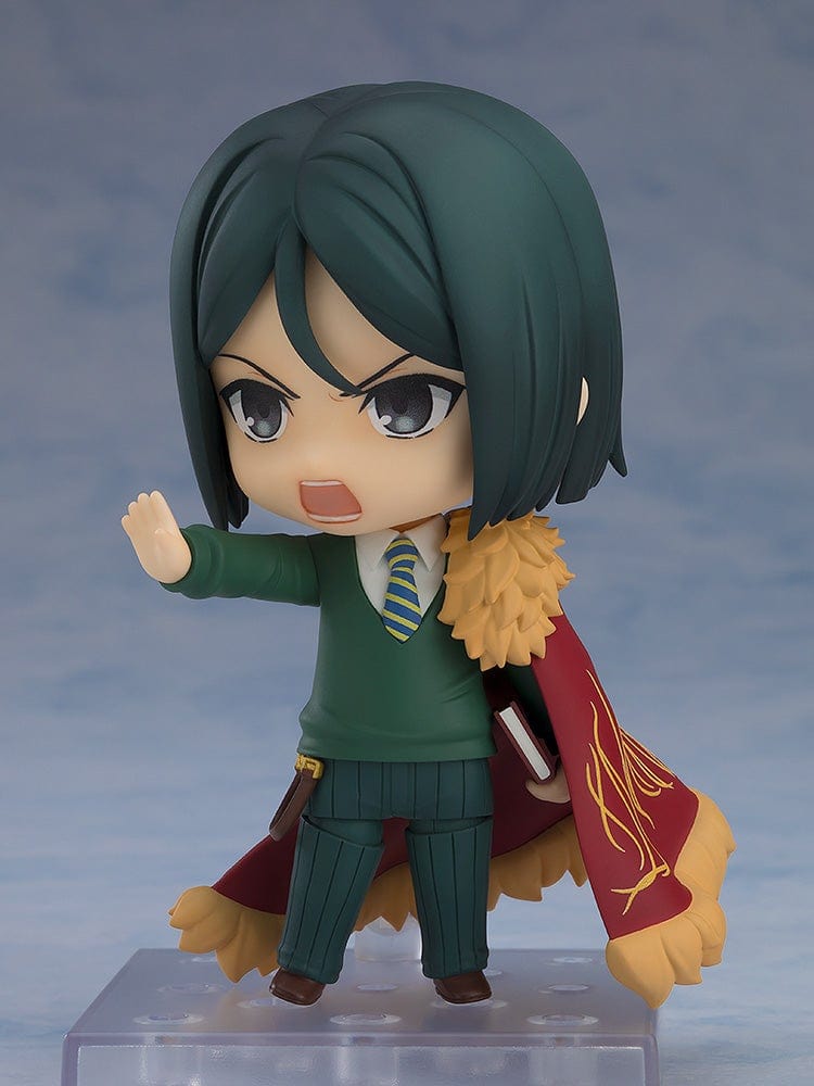 Fate/Grand Order Nendoroid No.2667 Caster/Zhuge Liang figure in a pose holding a spellbook, wearing a green suit and crimson cape with gold detailing.