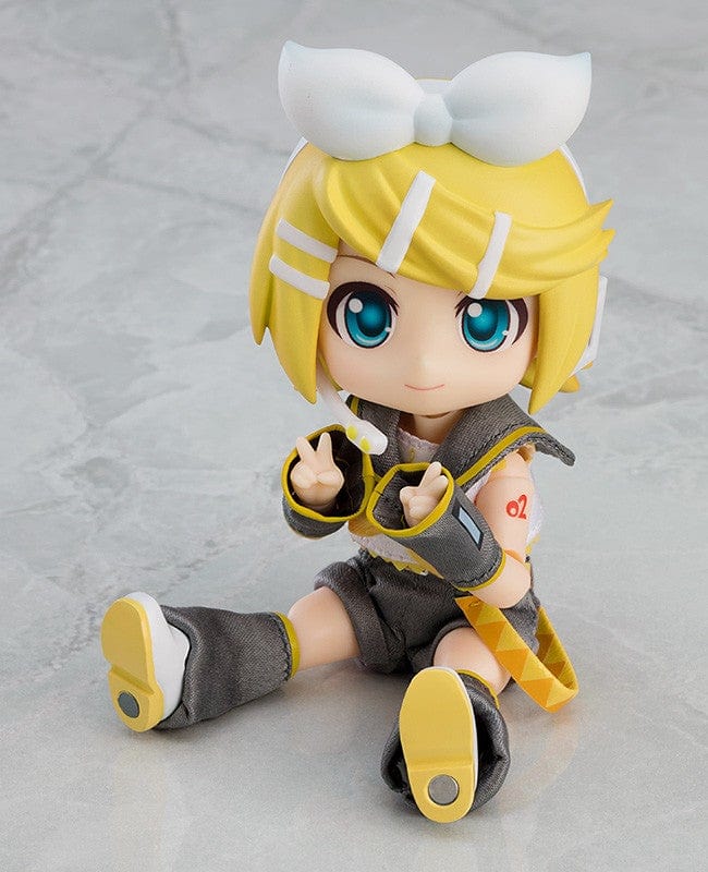 Vocaloid Nendoroid Doll Kagamine Rin (Reissue) featuring a posable body, yellow and gray outfit, white bow, and cheerful expression.