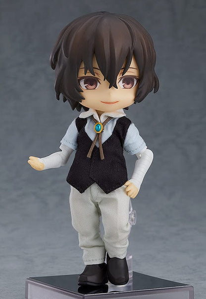 Bungo Stray Dogs Nendoroid Doll Osamu Dazai (Reissue) - A charming Nendoroid Doll figure of Osamu Dazai from the anime series Bungo Stray Dogs. Osamu Dazai, dressed in his signature outfit, stands in a dynamic pose with a mischievous smile. He holds a small book in one hand, exuding a whimsical and intellectual aura. This reissued collectible captures the character's personality and essence, making it a must-have for fans and collectors alike.