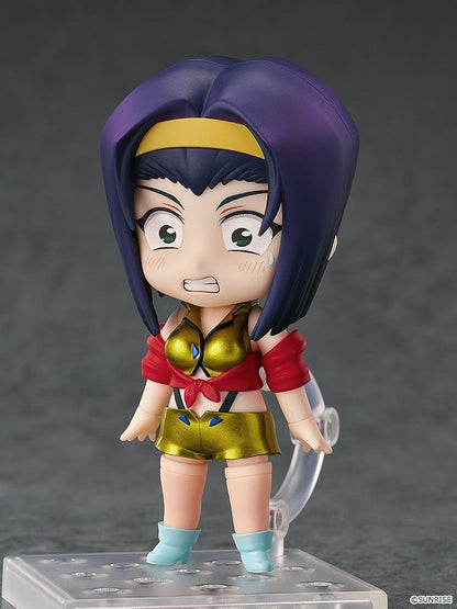 Faye Valentine Nendoroid from Cowboy Bebop in her yellow and red iconic outfit with a confident pose and green eyes.