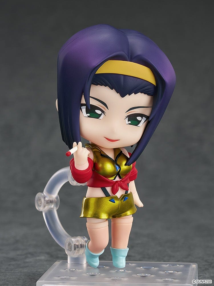 Faye Valentine Nendoroid from Cowboy Bebop in her yellow and red iconic outfit with a confident pose and green eyes.