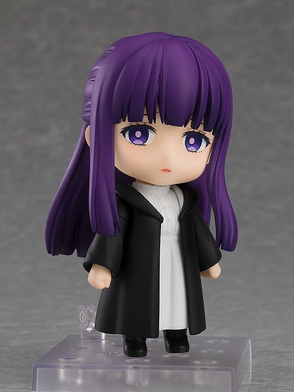 Frieren: Beyond Journey's End Nendoroid No.2368 Fern reissue figure featuring purple hair, black cloak, and iconic staff on a display base.