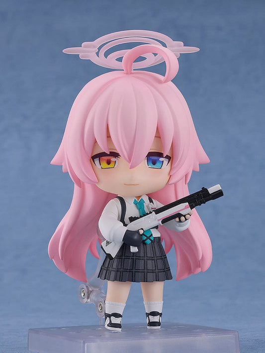 Blue Archive Nendoroid No.2461 Hoshino Takanashi showcases the character in her school uniform with a tactical twist, wielding a sniper rifle. The figure includes characteristic pink hair styled with a futuristic halo, conveying both her innocent appearance and battle-ready nature.
