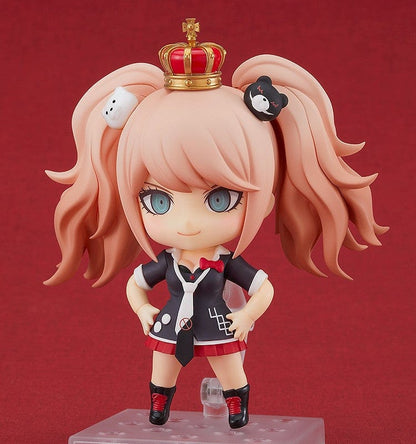 Danganronpa 1.2 Reload Nendoroid No.1398 Junko Enoshima (Reissue) with Monokuma, twin-tail hairstyle, and detailed school uniform on a red background.