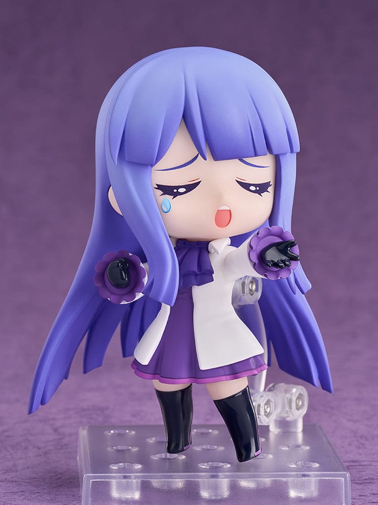 Muse Dash Nendoroid No.2507 Marija figure in a purple and white dress with a large white hat, holding a pointer, ready to bring the rhythm to your collection.