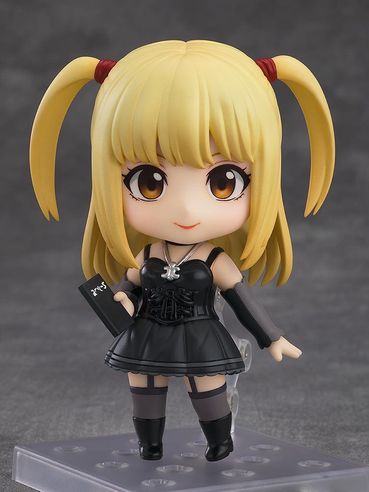 Death Note Nendoroid Misa Amane 2.0 figure featuring a black gothic dress, twin ponytails, and a Death Note accessory, posed against a gray background.