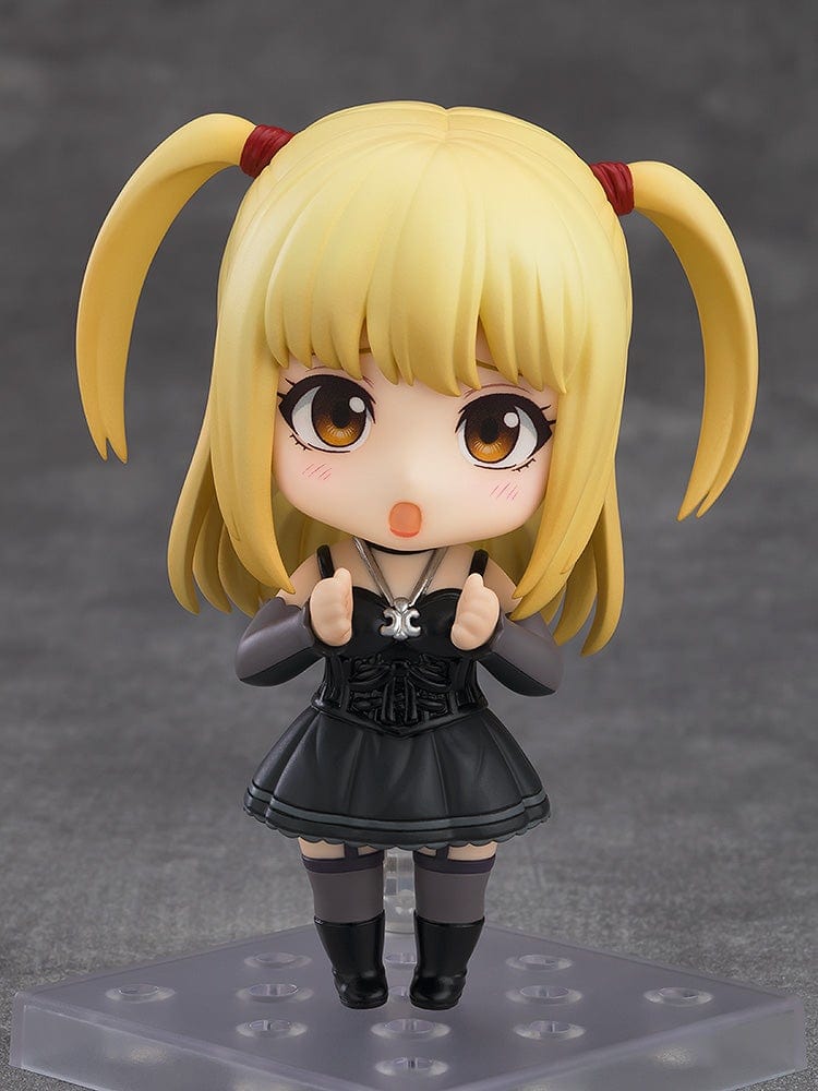 Death Note Nendoroid Misa Amane 2.0 figure featuring a black gothic dress, twin ponytails, and a Death Note accessory, posed against a gray background.