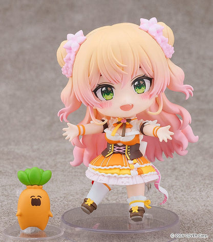 Hololive Production Nendoroid No.2502 Momosuzu Nene figure featuring Nene in her colorful idol outfit, smiling with her hands raised in excitement.