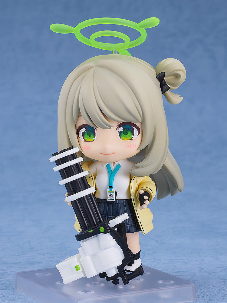 Blue Archive Nendoroid No.2511 Nonomi Izayoi featuring iconic outfit, vibrant green eyes, and mini-gun accessory, perfect for fans and collectors.