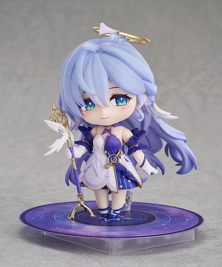 Honkai: Star Rail Nendoroid No.2694 Robin figure with sky-blue hair, a white and purple outfit, gold accents, and a halo accessory.