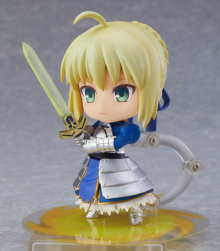 Chibi-style Nendoroid figure of Altria Pendragon (Saber) from Fate/Grand Order, wearing a crown, armored outfit, blue cape, and holding Excalibur sword – True Name Revealed Ver. (Reissue).

