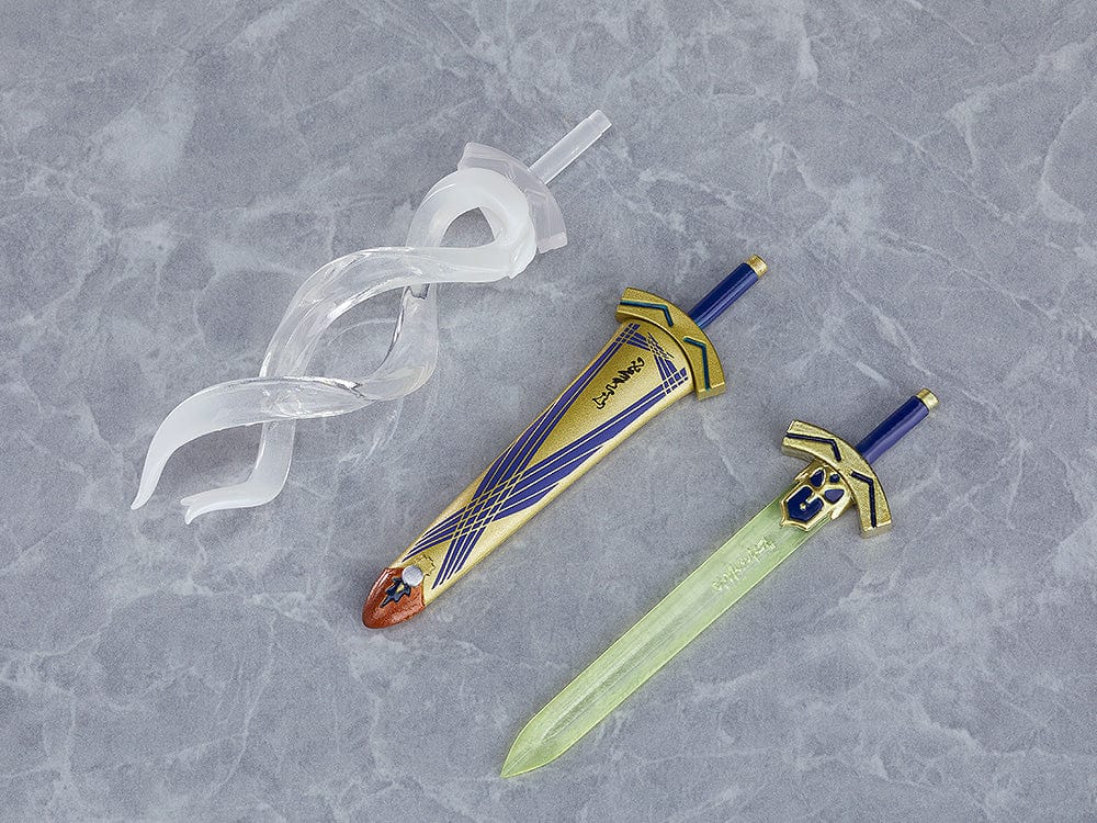 Chibi-style Nendoroid figure of Altria Pendragon (Saber) from Fate/Grand Order, wearing a crown, armored outfit, blue cape, and holding Excalibur sword – True Name Revealed Ver. (Reissue).

