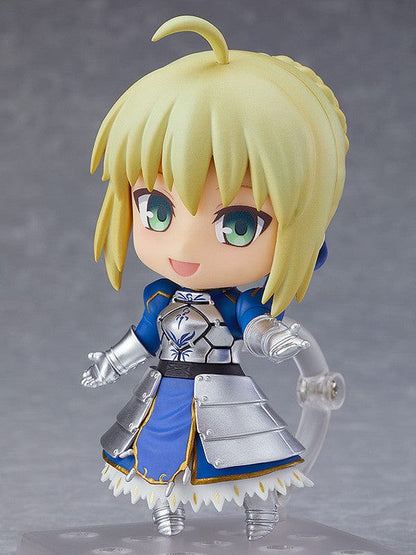 Chibi-style Nendoroid figure of Altria Pendragon (Saber) from Fate/Grand Order, wearing a crown, armored outfit, blue cape, and holding Excalibur sword – True Name Revealed Ver. (Reissue).


