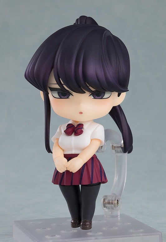 Komi Can't Communicate Nendoroid Shoko Komi (Ponytail Ver.) in her Itan High School uniform, with hands clasped in front and a serene expression, embodying her quiet charm.