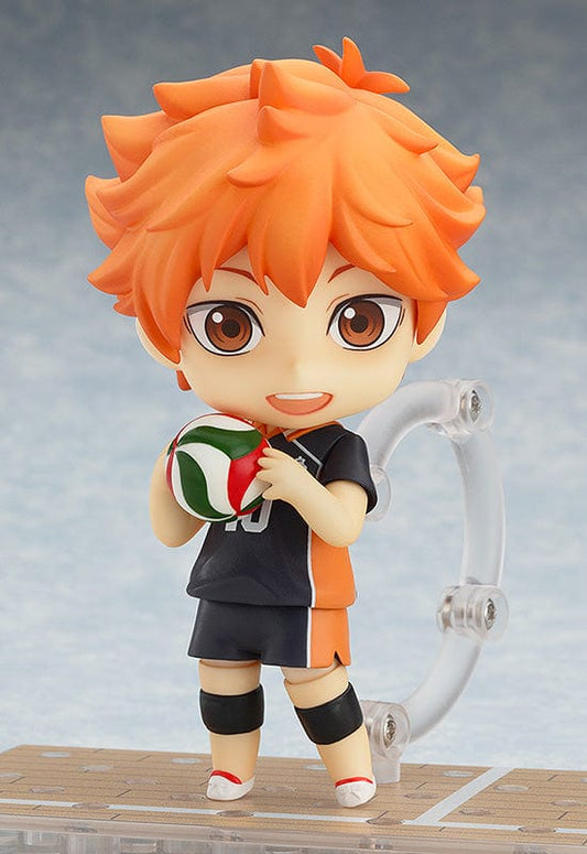 Haikyu!! Nendoroid Shoyo Hinata (5th-run) with orange hair, black and orange jersey number 10, holding a volleyball, displaying joyous character in a lively pose.