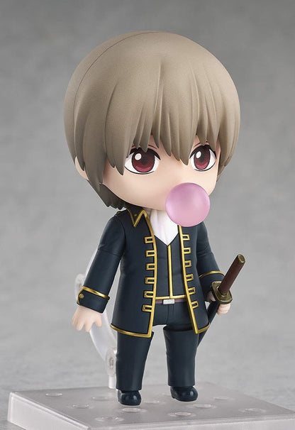 Gintama Nendoroid No.2584 Sogo Okita figure in a Shinsengumi uniform holding a katana, posed against a light gray background.