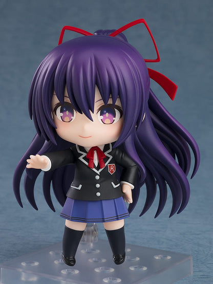 Nendoroid figure No.2454 of Tohka Yatogami from Date a Live, dressed in her school uniform, featuring her vibrant purple hair with red ribbons, starry eyes, and an endearing smile.