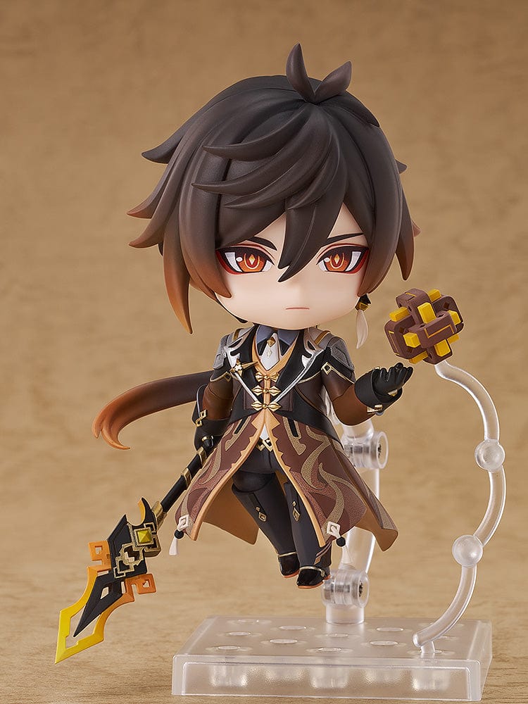 Genshin Impact Nendoroid No.2582 Zhongli featuring the Geo Archon with his signature spear and mini Geo construct in a chibi-style figure.