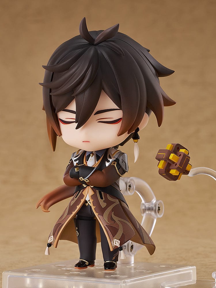 Genshin Impact Nendoroid No.2582 Zhongli featuring the Geo Archon with his signature spear and mini Geo construct in a chibi-style figure.