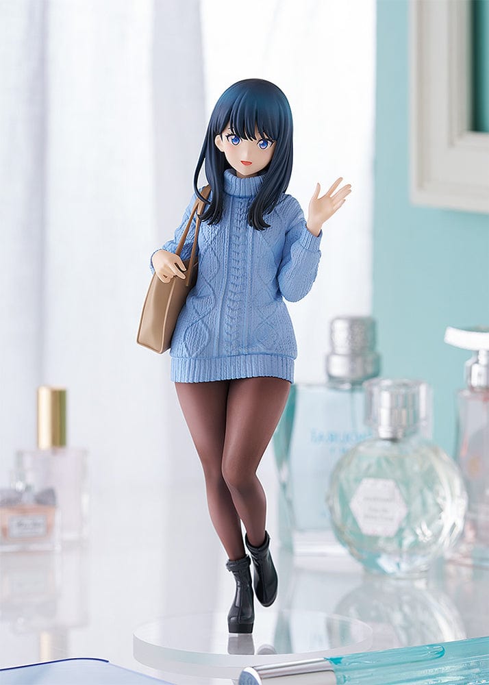 Gridman Universe POP UP PARADE L Rikka Takarada (Date Style Ver.) Figure, wearing a blue sweater dress with brown tights and holding a tan bag.