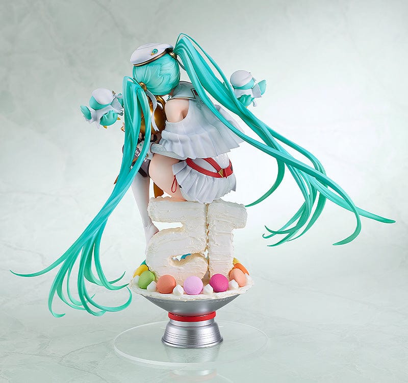 Hatsune Miku GT Project Racing Miku 2023 (15th Anniversary Ver.) 1/6 Scale Figure, posed on a dessert-like pedestal, featuring Miku in her race queen attire with festive teal hair and accompanied by miniature pit crew mascots, celebrating her 15th year in the spotlight.