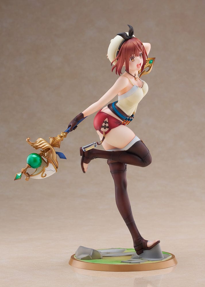 A 1/7 scale figure of Reisalin 'Ryza' Stout from Atelier Ryza, styled in a 'Summer Adventure!' version, standing on one leg with a cheerful expression, dressed in an adventurer's outfit with a magical staff in hand.